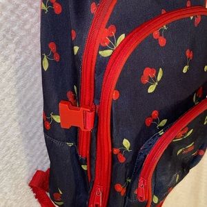 Navy blue & red cherry backpack.